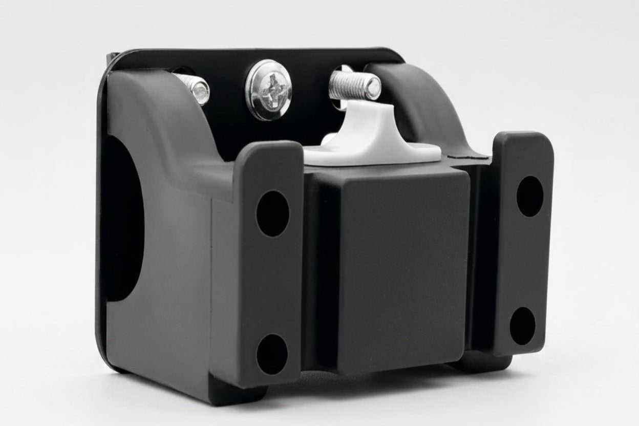 Black metal bracket with white component on a white background