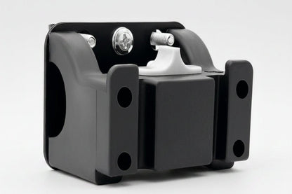 Black metal bracket with white component on a white background