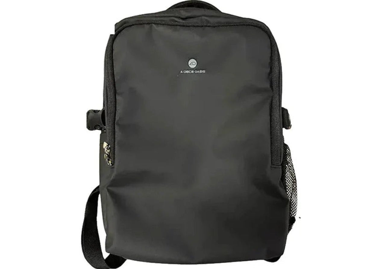A black nylon backpack with a top handle, adjustable shoulder strap, and a small white logo on the front, shown against a plain white background with a blue 'AQS' label in the top-left corner.