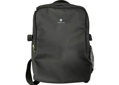 A black nylon backpack with a top handle, adjustable shoulder strap, and a small white logo on the front, shown against a plain white background with a blue 'AQS' label in the top-left corner.